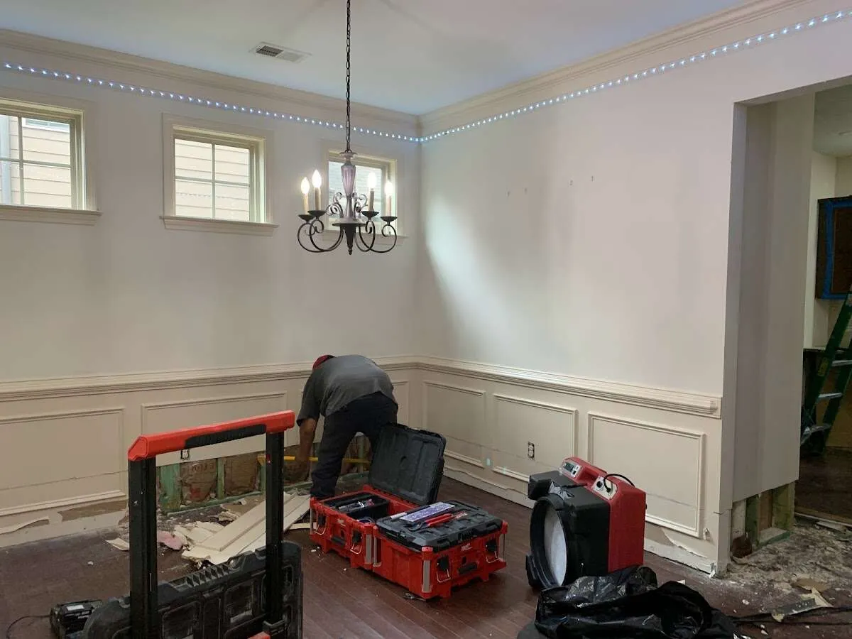 Restoration technician with professional equipment in Conyers